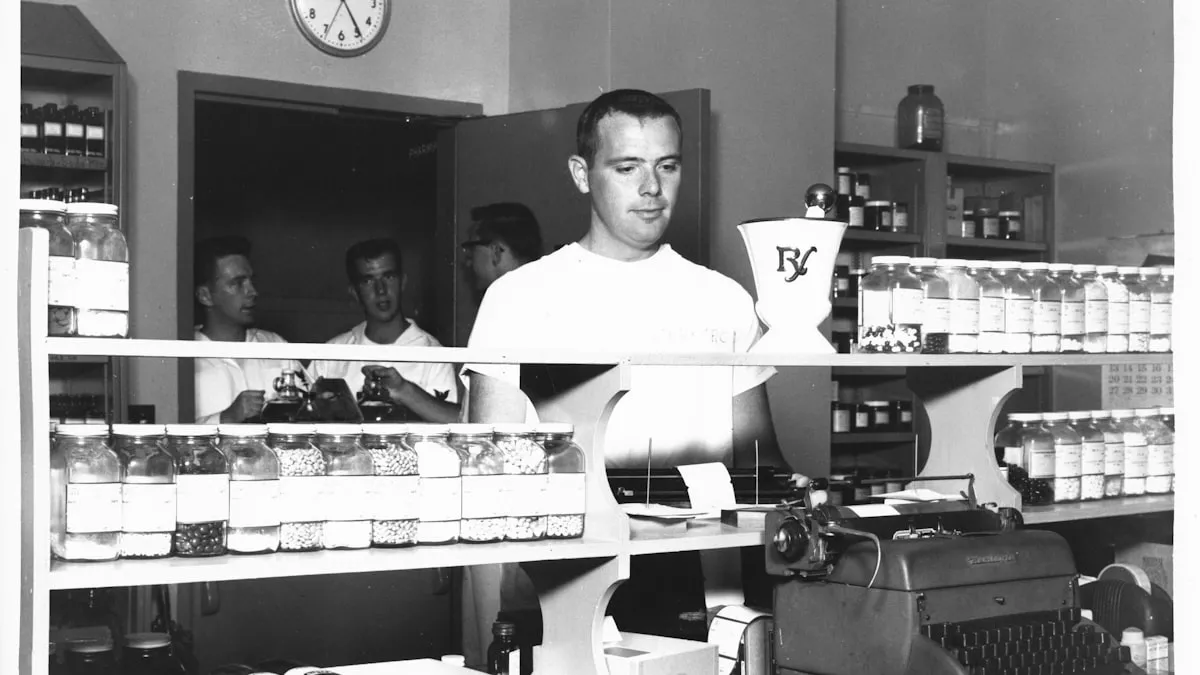 A pharmacist working behind a counter lined with labeled medicine bottles.