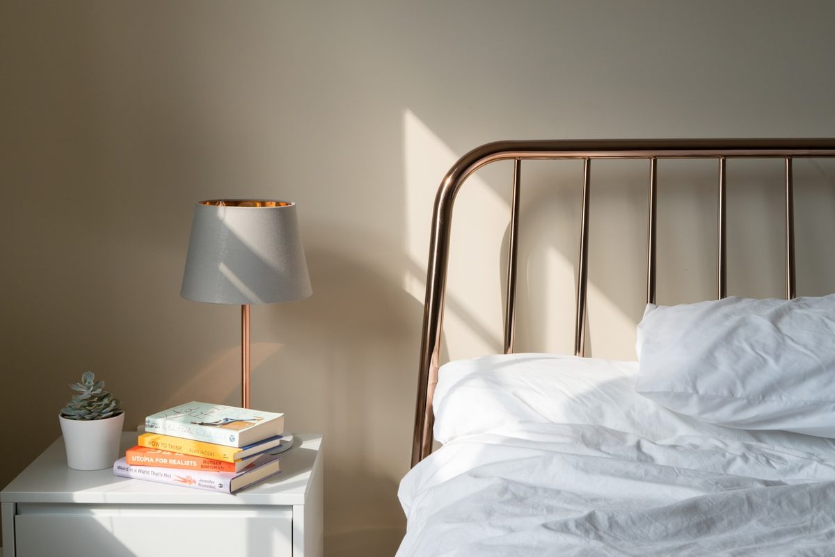 A calm bedside table and lamp